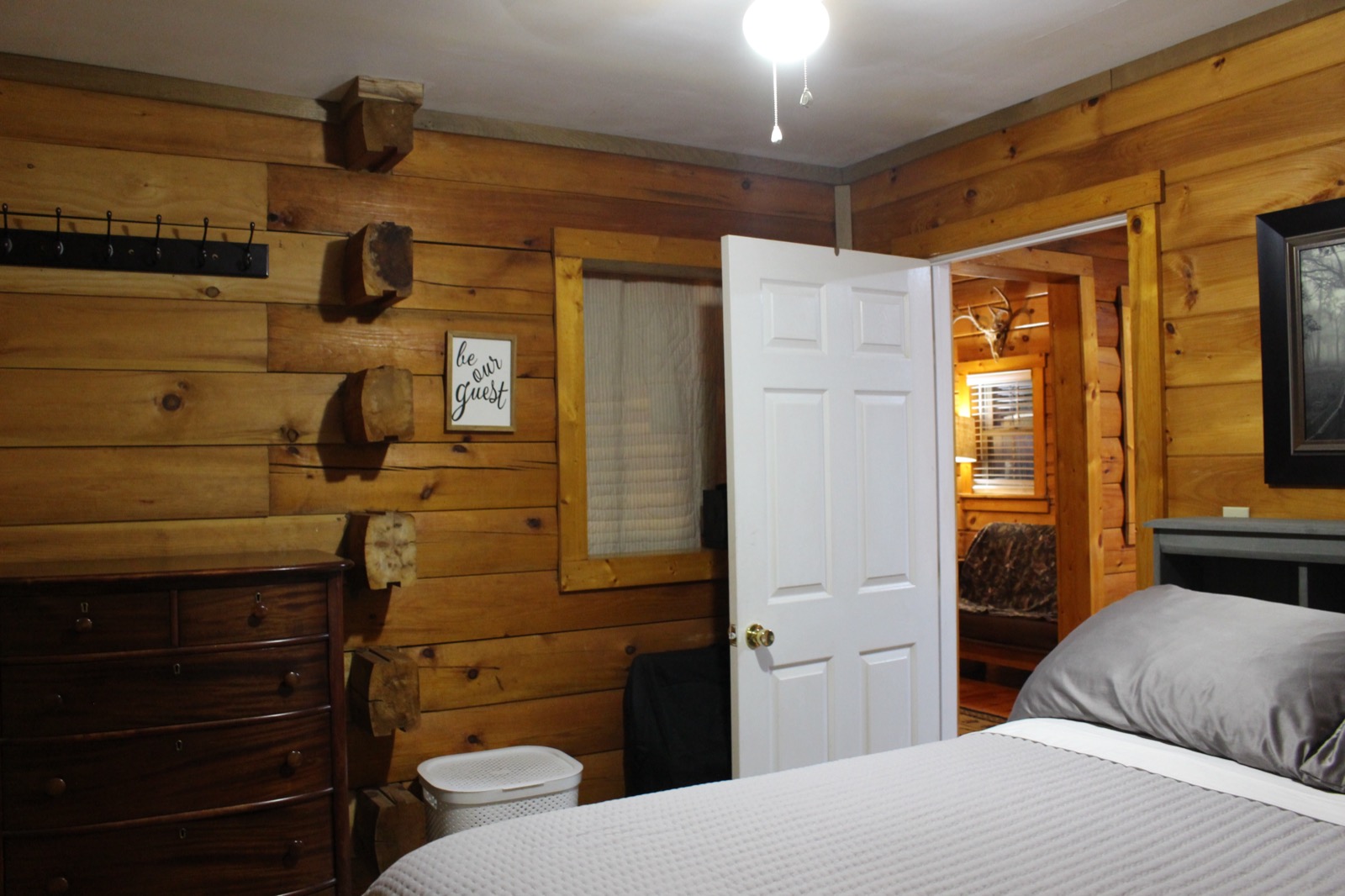 Second bedroom with a be our guest sign