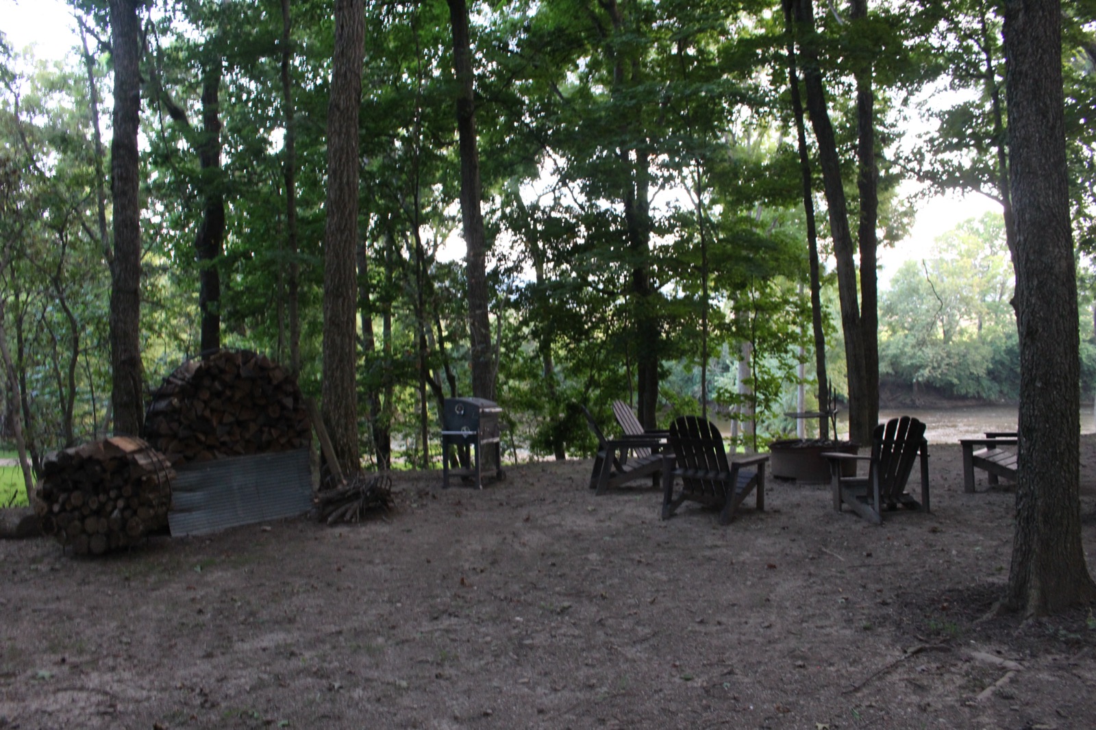 Stacked firewood near the firepit