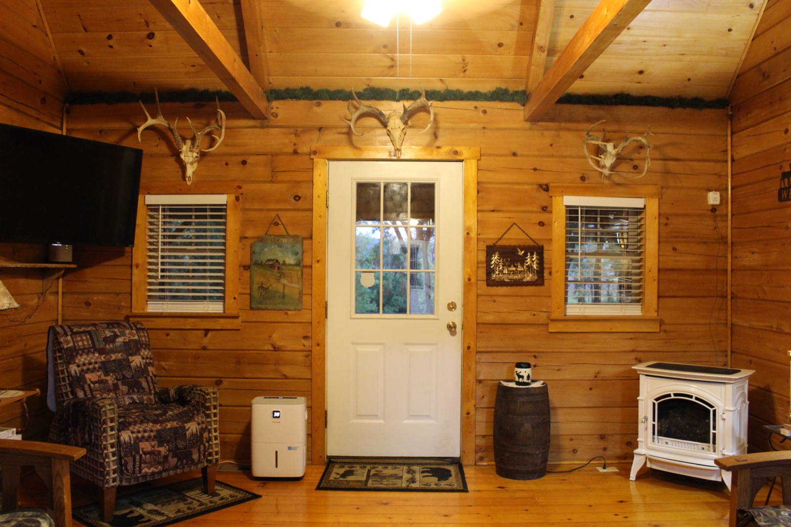 Living room entry door flanked by deer skull mounts